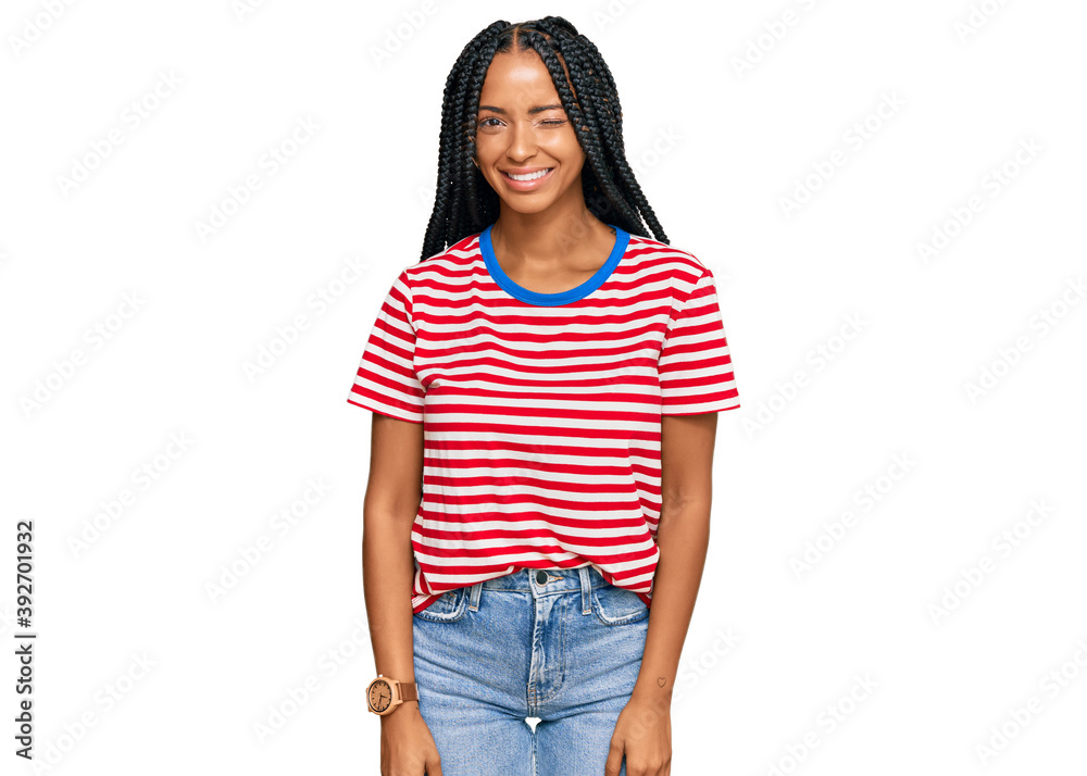 Beautiful hispanic woman wearing casual clothes winking looking at the camera with sexy expression, cheerful and happy face. Beautiful hispanic woman wearing casual clothes winking looking at the camera with sexy expression, cheerful and happy face.