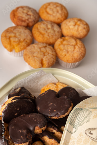 Freshly baked tasty sugar coated muffin on a white table