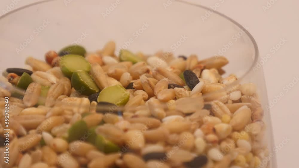 Detail rotation Healthy miscellaneous grains on a wine glass Detail rotation Healthy miscellaneous grains on a wine glass