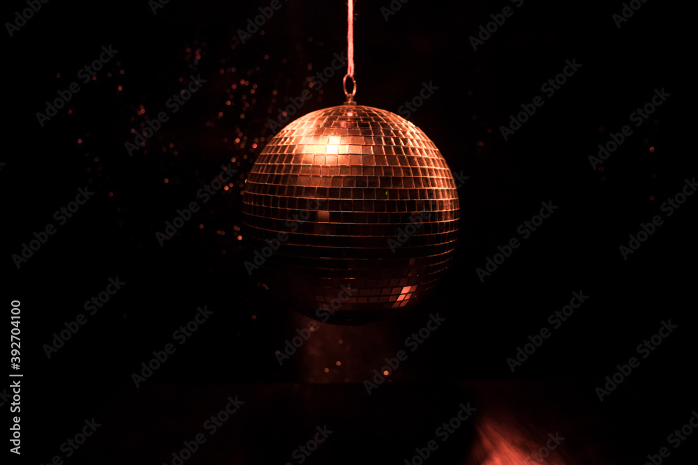 Obraz premium Colorful disco mirror ball lights night club background. Party lights disco ball. Selective focus