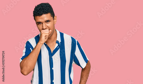 Young arab man wearing casual clothes feeling unwell and coughing as symptom for cold or bronchitis. health care concept.