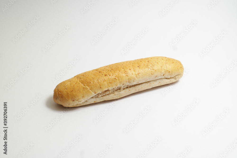 Mini baguette bakery made from graham flour, typical baker of Slovak republic, on the white background Mini baguette bakery made from graham flour, typical baker of Slovak republic, on the white background
