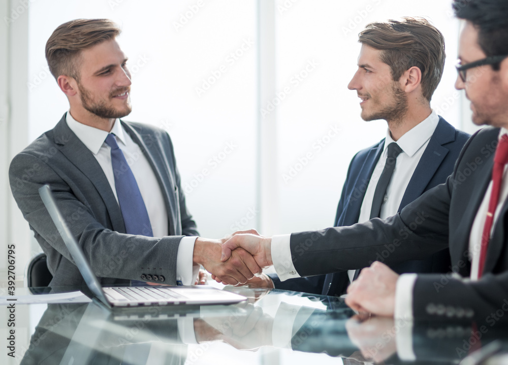 handshake of business partners at a meeting in the office handshake of business partners at a meeting in the office