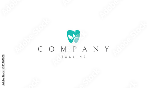 Vector logo on which an abstract image of a tooth with a silhouette of a plant inside.