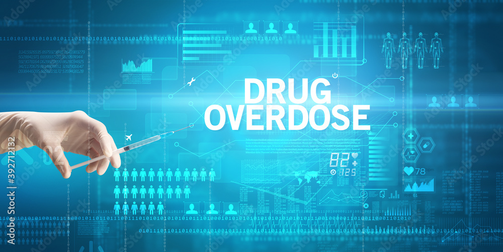 Close-up view of doctor's hand in a white glove holding syringe with DRUG OVERDOSE inscription, healthcare and medical concept