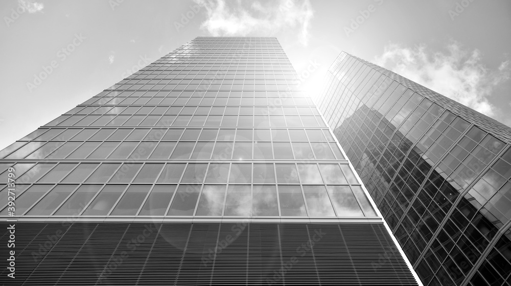 Fototapeta premium Abstract modern architecture with high contrast black and white tone. Architecture of geometry at glass window - monochrome. Black and white.