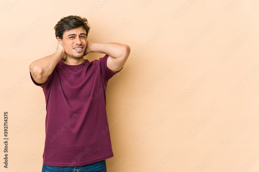 Young cool man touching back of head, thinking and making a choice. Young cool man touching back of head, thinking and making a choice.