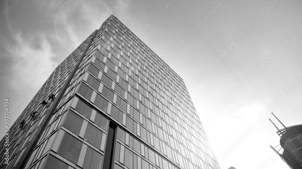 Fototapeta premium Abstract modern architecture with high contrast black and white tone. Architecture of geometry at glass window - monochrome. Black and white.