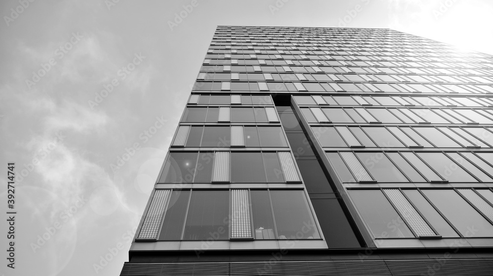Fototapeta premium Abstract modern architecture with high contrast black and white tone. Architecture of geometry at glass window - monochrome. Black and white.
