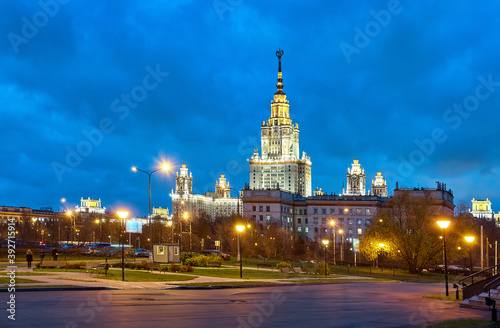Autumn park and night campus of Moscow university