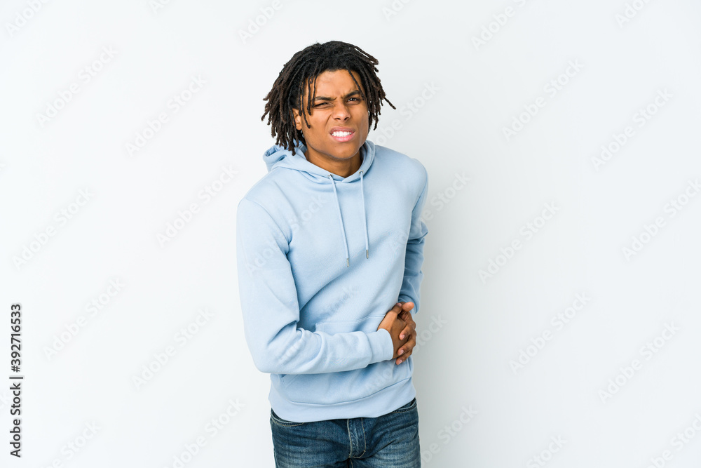 Young african american rasta man having a liver pain, stomach ache. Young african american rasta man having a liver pain, stomach ache.