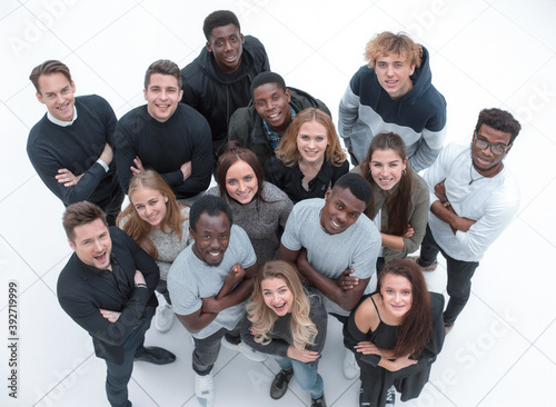 large group of diverse young people looking at the camera . © ASDF