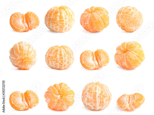 Set of fresh ripe tangerines on white background