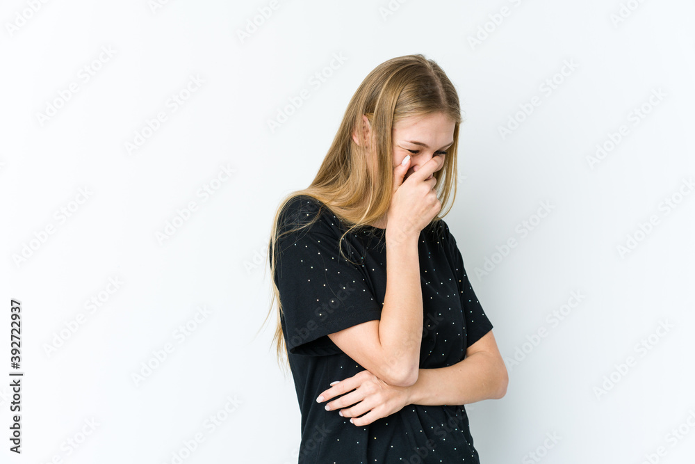 Young blonde woman isolated on white background laughing happy, carefree, natural emotion. Young blonde woman isolated on white background laughing happy, carefree, natural emotion.