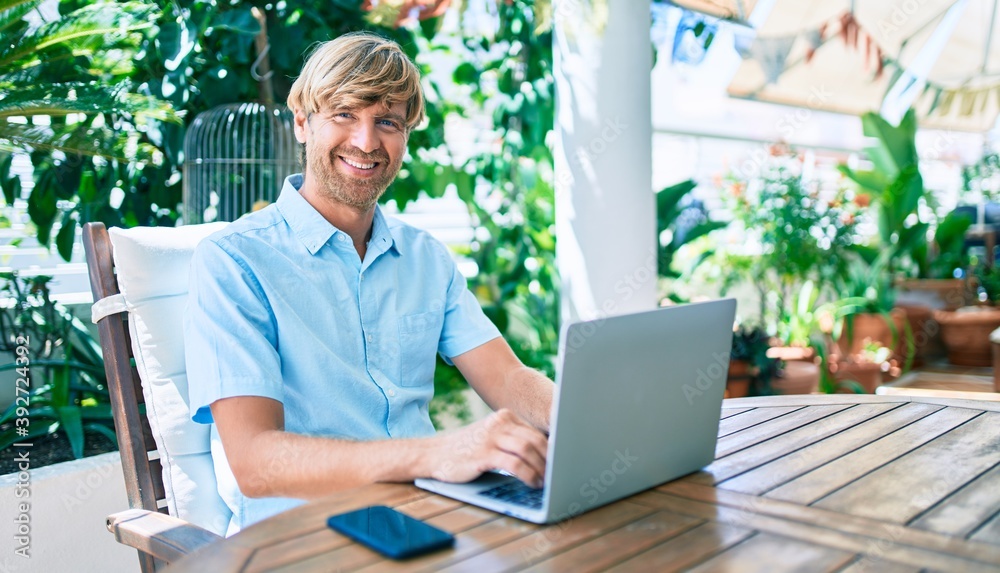 Middle age handsome man working at home using computer laptop Middle age handsome man working at home using computer laptop