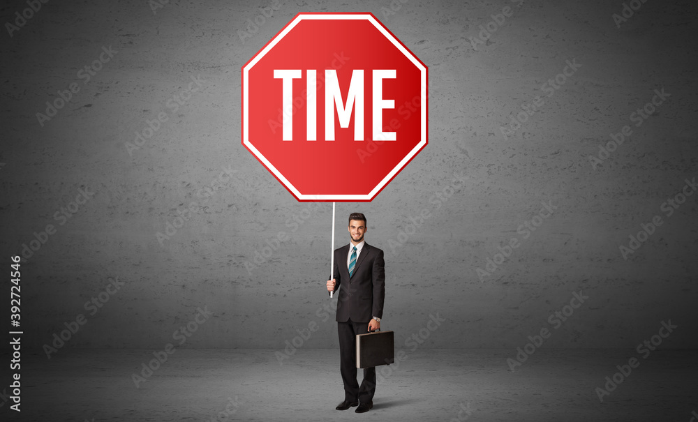 Young business person holding road sign with TIME inscription, new rules concept Young business person holding road sign with TIME inscription, new rules concept