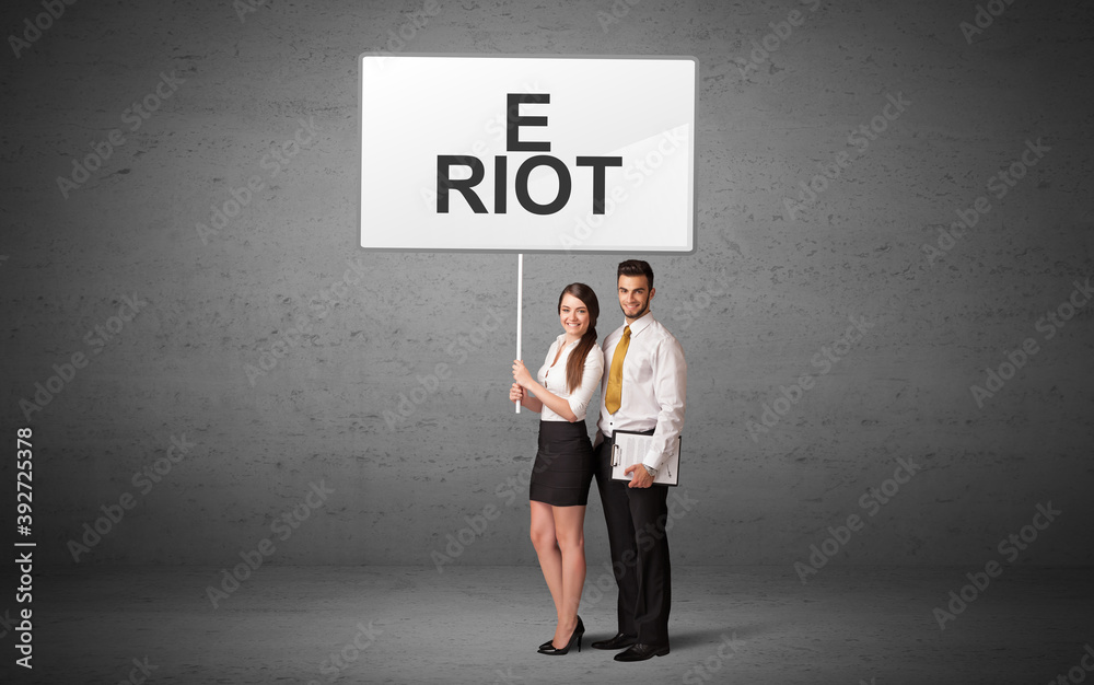 business person holding a traffic sign with E RIOT inscription, new idea concept business person holding a traffic sign with E RIOT inscription, new idea concept
