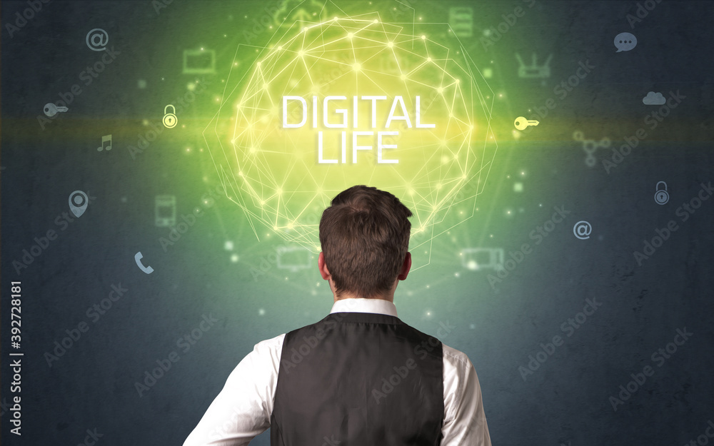 Rear view of a businessman with DIGITAL LIFE inscription, online security concept Rear view of a businessman with DIGITAL LIFE inscription, online security concept