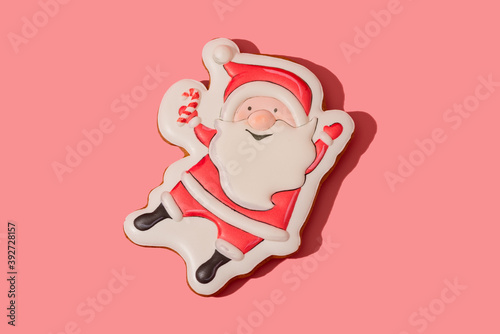 Santa Claus gingerbread on the pink background photo
