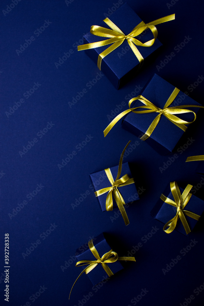 Navy blue gifts with gold ribbons.Set of gift box isolated on navy blue background.Christmas gift boxes on black background. Merry Christmas and Happy Holidays greeting card, frame, banner. Navy blue gifts with gold ribbons.Set of gift box isolated on navy blue background.Christmas gift boxes on black background. Merry Christmas and Happy Holidays greeting card, frame, banner.