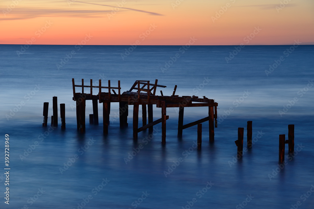 Broken pier at Baltic sea.