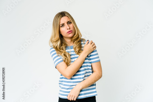 Young caucasian blonde woman having a shoulder pain.