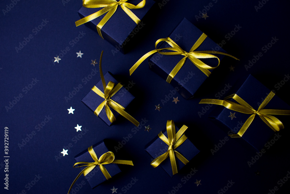 Navy blue gifts with gold ribbons.Set of gift box isolated on navy blue background.Christmas gift boxes on black background. Merry Christmas and Happy Holidays greeting card, frame, banner. Navy blue gifts with gold ribbons.Set of gift box isolated on navy blue background.Christmas gift boxes on black background. Merry Christmas and Happy Holidays greeting card, frame, banner.
