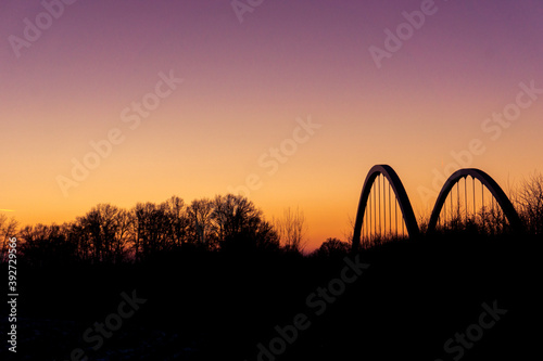 Landscape silhouette with bridge of munsterland at dusk