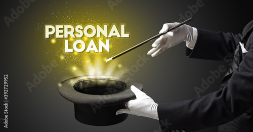 Illusionist is showing magic trick with PERSONAL LOAN inscription, new business model concept