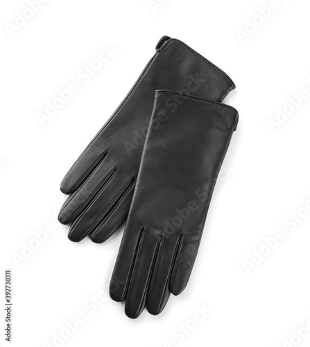 Stylish black leather gloves on white background, top view