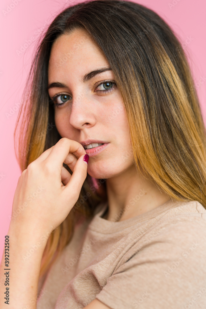 Young beautiful woman isolated on pink background Young beautiful woman isolated on pink background