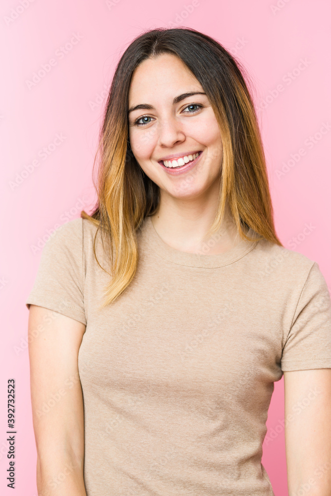 Young beautiful woman isolated on pink background Young beautiful woman isolated on pink background