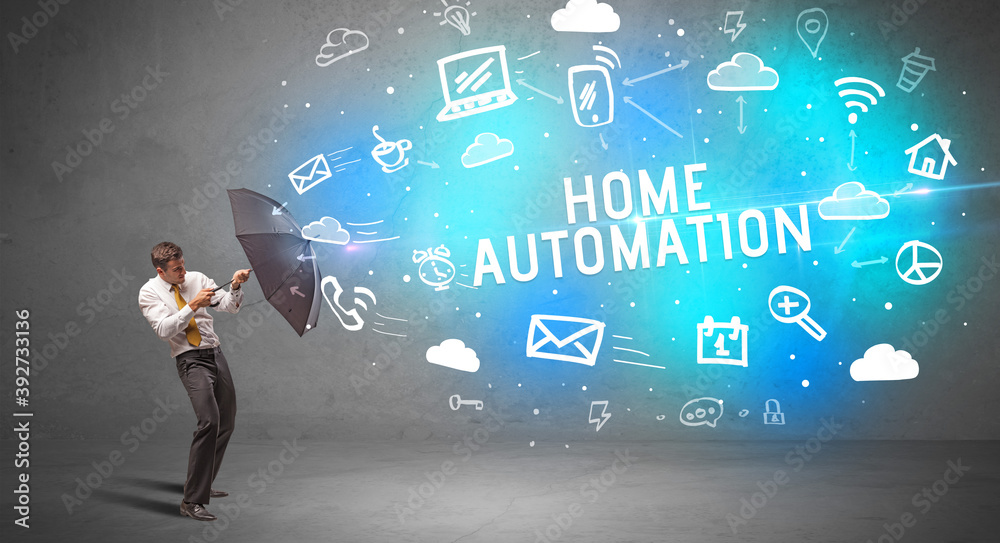 Businessman defending with umbrella from HOME AUTOMATION inscription, modern technology concept Businessman defending with umbrella from HOME AUTOMATION inscription, modern technology concept