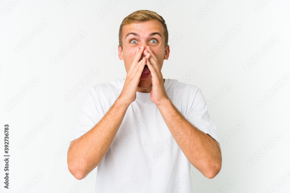 Young caucasian handsome man shouting excited to front. Young caucasian handsome man shouting excited to front.