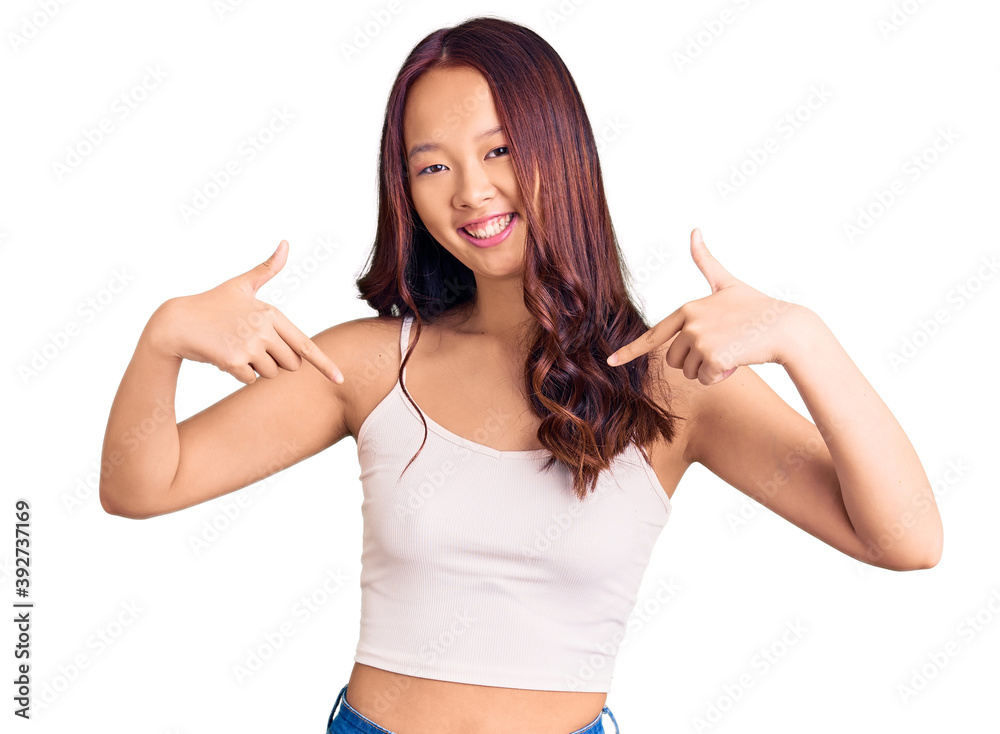 Young beautiful chinese girl wearing casual clothes looking confident with smile on face, pointing oneself with fingers proud and happy. Young beautiful chinese girl wearing casual clothes looking confident with smile on face, pointing oneself with fingers proud and happy.