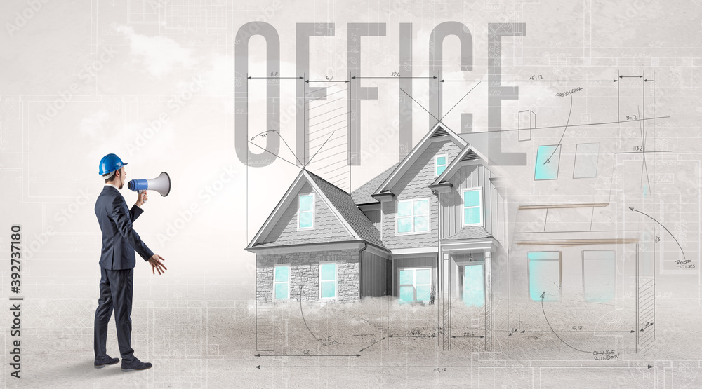Young engineer holding blueprint with OFFICE inscription, house planning concept Young engineer holding blueprint with OFFICE inscription, house planning concept