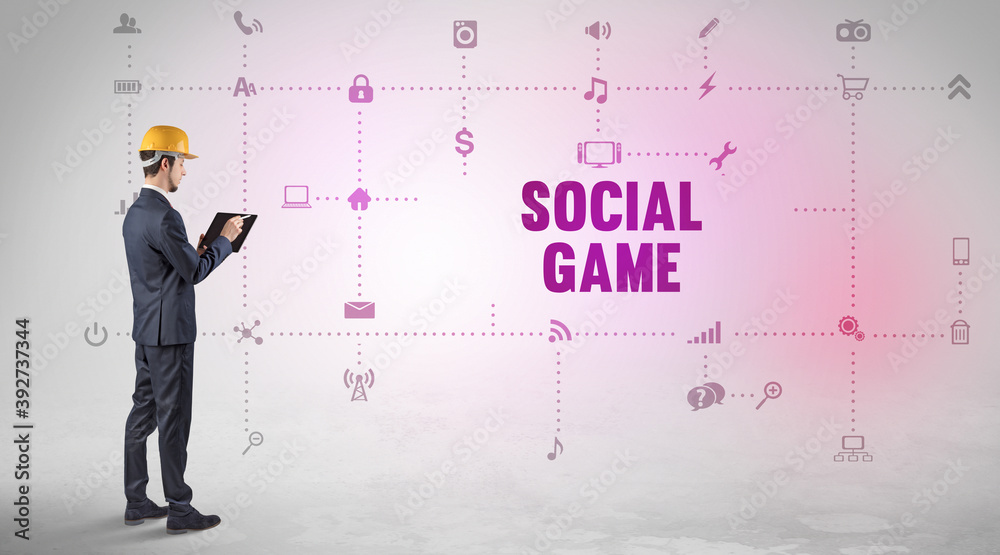 Engineer working on a new social media platform with SOCIAL GAME inscription concept Engineer working on a new social media platform with SOCIAL GAME inscription concept
