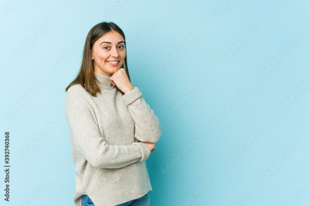 Young caucasian woman smiling happy and confident, touching chin with hand. Young caucasian woman smiling happy and confident, touching chin with hand.