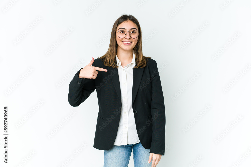 Young caucasian business woman person pointing by hand to a shirt copy space, proud and confident
