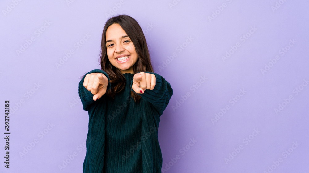 Young mixed race hispanic woman isolated cheerful smiles pointing to front. Young mixed race hispanic woman isolated cheerful smiles pointing to front.