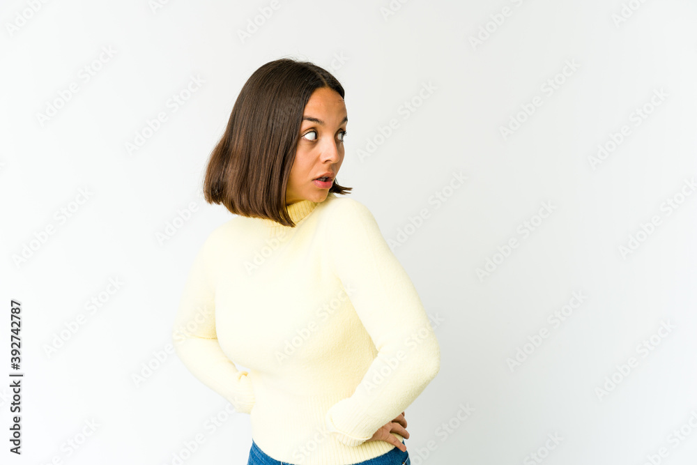 Young mixed race woman looks aside smiling, cheerful and pleasant. Young mixed race woman looks aside smiling, cheerful and pleasant.