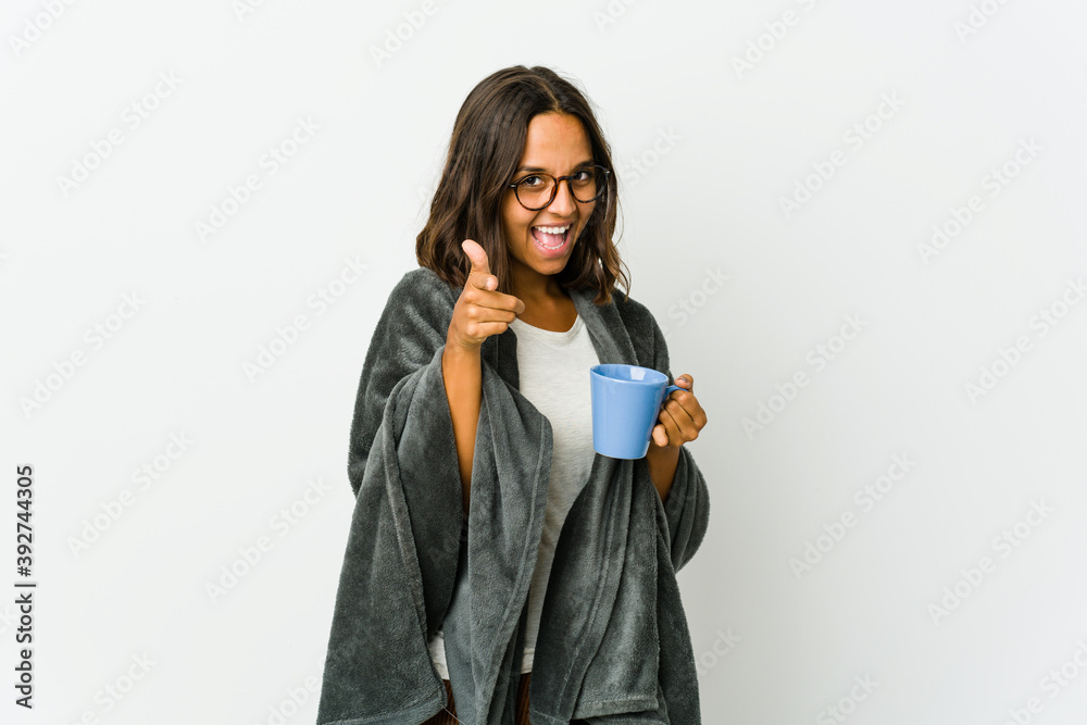 Young latin woman with blanket isolated on white background Young latin woman with blanket isolated on white background