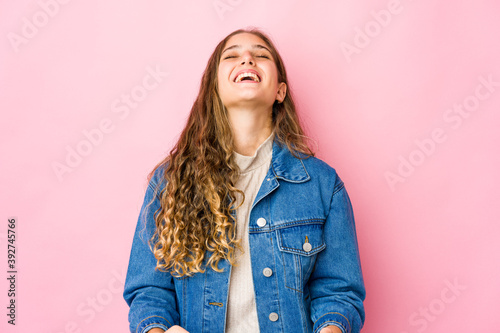 Young caucasian woman relaxed and happy laughing, neck stretched showing teeth.
