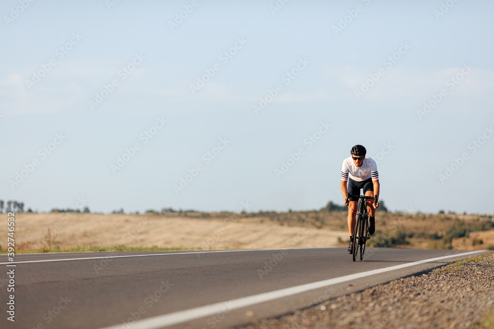 Enduring man practising in cycling during morning time