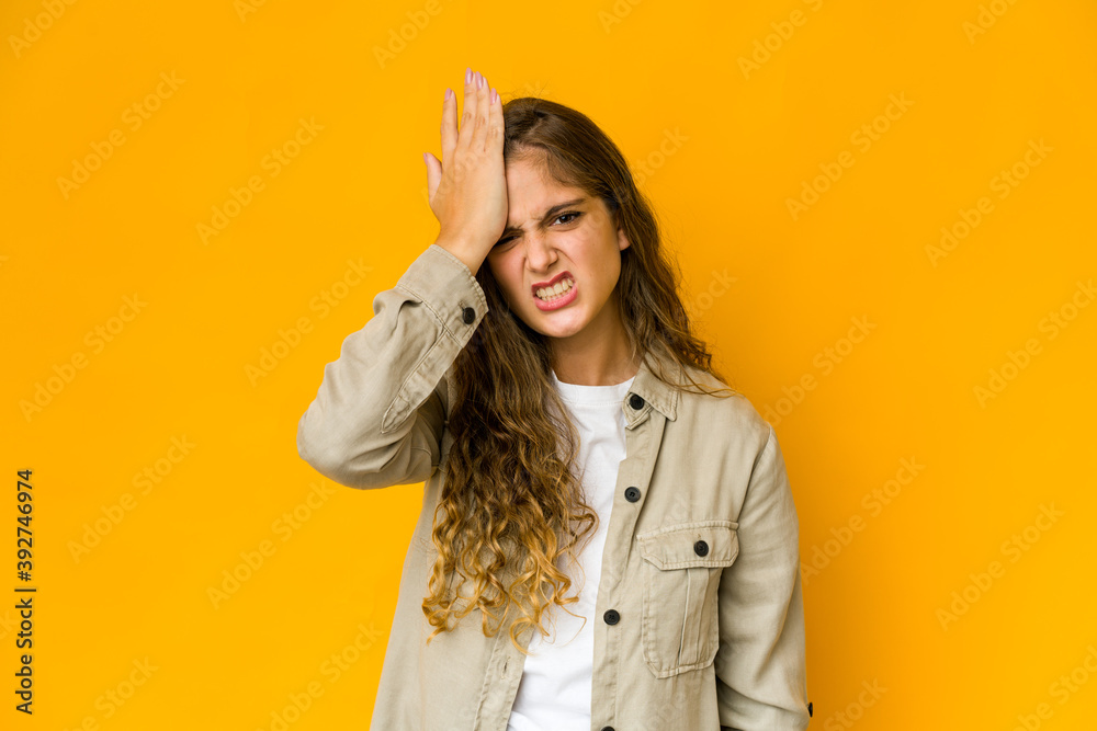 Young caucasian woman forgetting something, slapping forehead with palm and closing eyes. Young caucasian woman forgetting something, slapping forehead with palm and closing eyes.