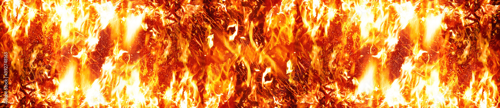 Fototapeta premium Long Fire flames on black background. fire burst texture for banner backdrop.