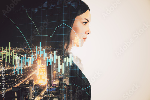 Young businesswoman silhouette with stock report hologram © Who is Danny
