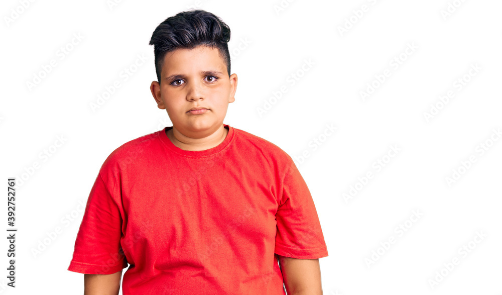Little boy kid wearing casual clothes with serious expression on face. simple and natural looking at the camera. Little boy kid wearing casual clothes with serious expression on face. simple and natural looking at the camera.