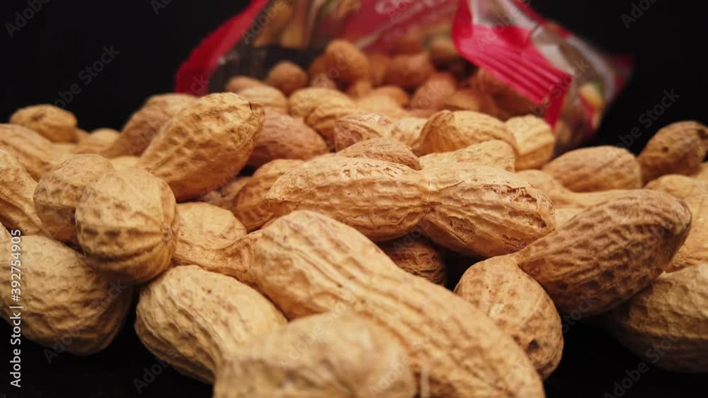 Roasted peanuts in close up - food photography Roasted peanuts in close up - food photography