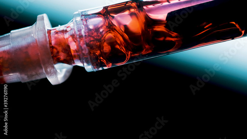 Taking blood with a syringe. Addict's infected blood